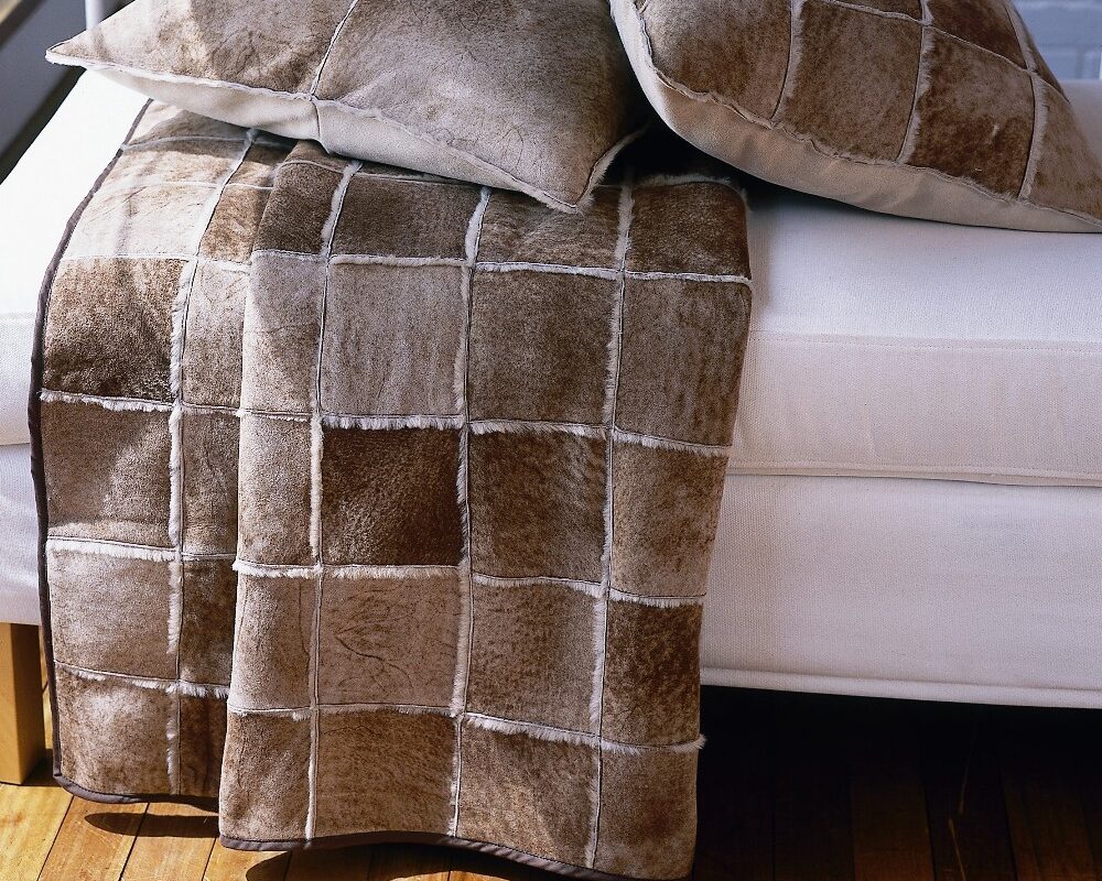 lambskin throw and pillows in patchwork design