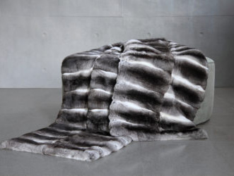 Luxurious natural chinchilla fur throw lined with cashmere, styled as a bed runner – Dentro Home